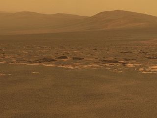 A portion of the west rim of Endeavour crater sweeps southward in this color view from NASA's Mars Exploration Rover Opportunity. This crater — with a diameter of about 14 miles (22 kilometers) — is more than 25 times wider than any that Opportunity has previously approached during the rover's 90 months on Mars.