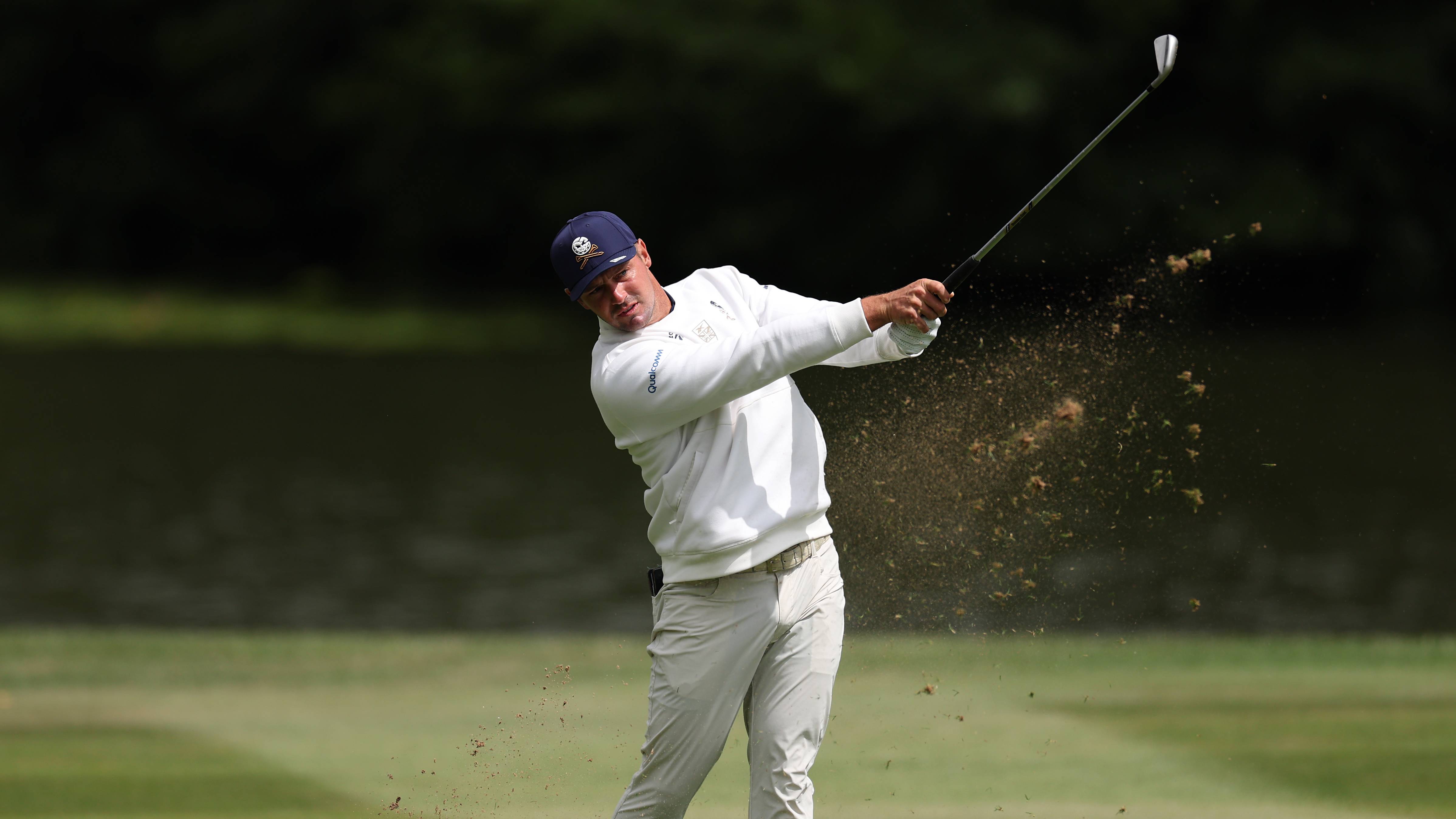 Bryson DeChambeau hitting an iron shot