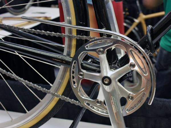 The custom stainless steel chain guard is polished to a high lustre.