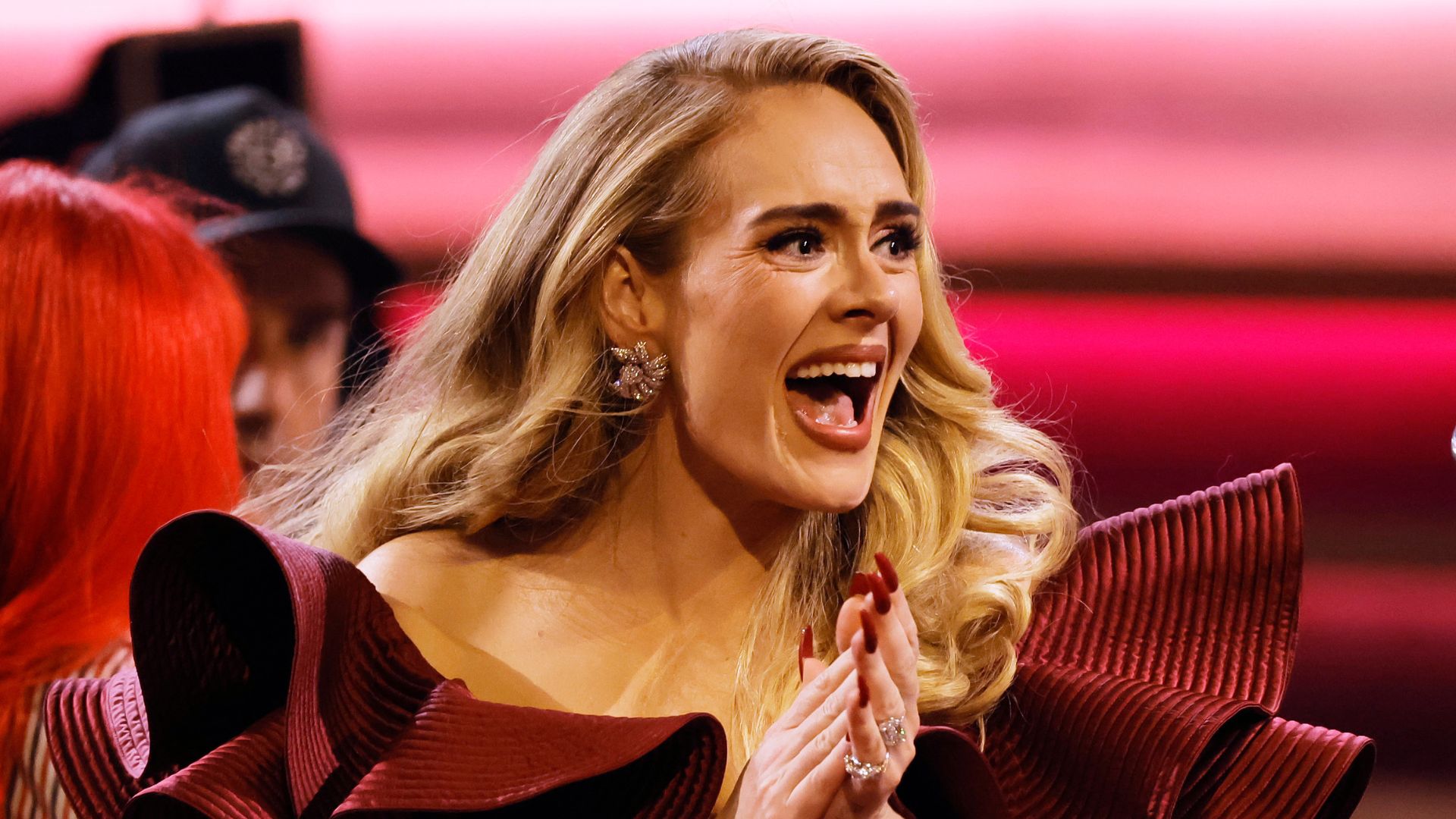 We're obsessed with Adele's new trench coat and gold earrings