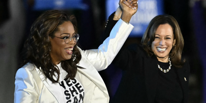 Democratic presidential nominee, U.S. Vice President Kamala Harris (R) speaks alongside Oprah Winfrey during the closing rally of her campaign at the base of the iconic &quot;Rocky Steps&quot; at the Philadelphia Museum of Art on November 05, 2024 in Philadelphia, Pennsylvania. With one day to go until election day, Vice President Kamala Harris is campaigning across Pennsylvania. 