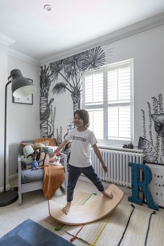 Kid's bedrom with black and white wall mural