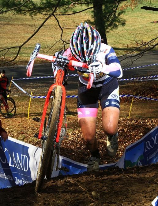 Arley Kemmerer (PB2 Pro Cycling) keeps an eye on her extra long spikes- which came in handy on the muddy run-up.