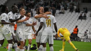 Marseille players celebrate their team's fourth goal during the UEFA Champions match between Marseille and Sporting Lisbon on 4 October, 2022 at the Orange Velodrome, Marseille, France