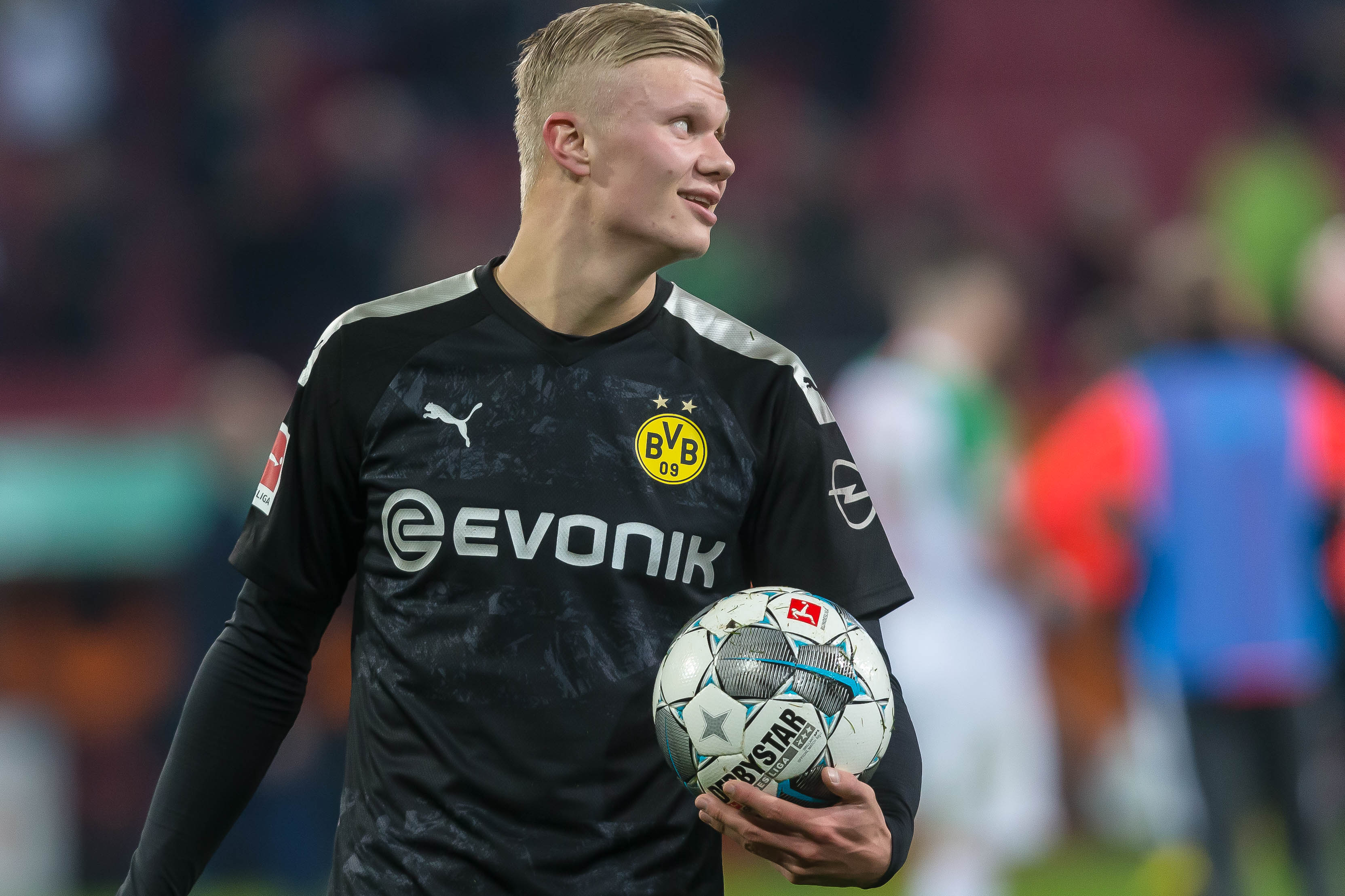 Erling Haaland holds the match ball after scoring a hat-trick against Augsburg on his Borussia Dortmund debut in January 2020.