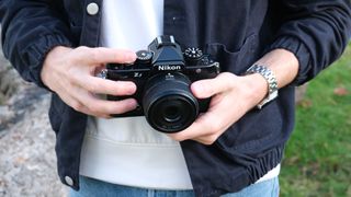 Nikon Zf camera held in hands
