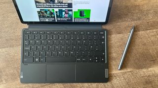Lenovo keyboard and stylus attached to the Lenovo tablet