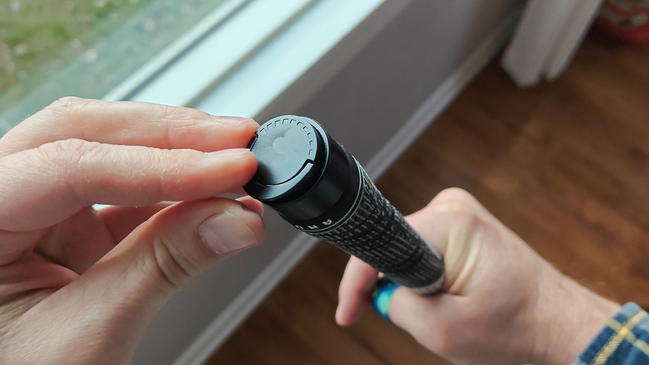 How to adjust the force needed to activate the mechanism in the AMVR haptic golf club accessory for Meta Quest 3 and 3S