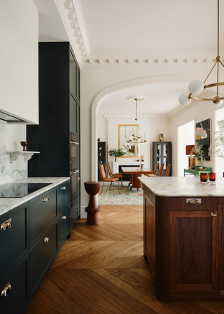 The dining area is connected by a large arch which leads on to the kitchen