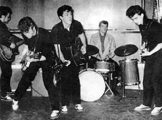 The Silver Beatles (L-R Stu Sutcliffe, John Lennon, Paul McCartney, Johnny Hutch and George Harrison) on stage in 1960 in Liverpool England. The drummer Johnny Hutch was sitting in as they did not have a regular drummer that day.