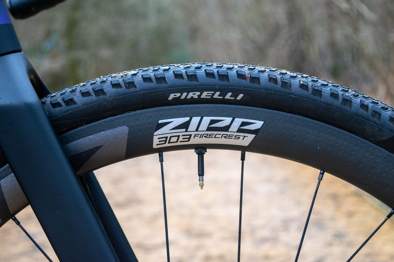 A Zipp 303 Firecrest wheel with a Pirelli gravel tyre fitted