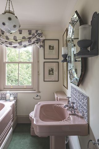 Pink bathroom fittings in an extended Victorian cottage