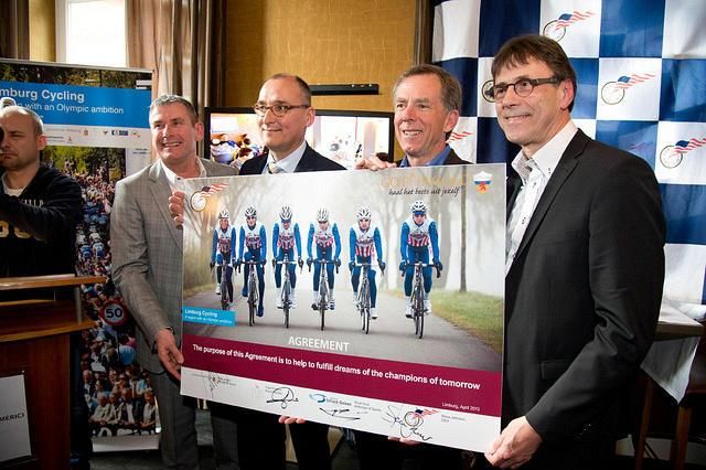 USA Cycling president Steve Johnson and Limburg officials display the signed agreement for the training facility.