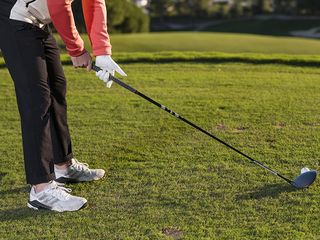 Alex Elliott demonstrating a good driver grip drill where the club is as low as possible before being picked up in the fingers like a shopping basket