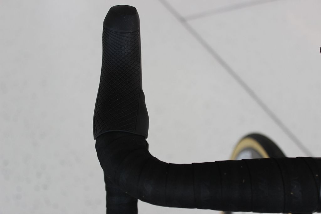 The new Dura-Ace hoods have textured grips, a first for Shimano, and a single button atop the hood