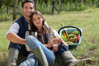 romantic couple having a picnic outside