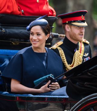 Prince Harry, Duke of Sussex and Meghan, Duchess of Sussex ride by carriage down the Mall during Trooping The Colour, the Queen's annual birthday parade, on June 08, 2019 in London