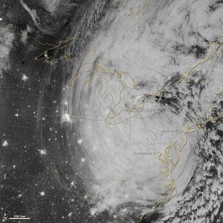 This nighttime view of Sandy was taken overnight (Oct. 30) by the Visible Infrared Imaging Radiometer Suite (VIIRS) on the Suomi NPP satellite around 3:35 a.m. EDT. The cloud tops were illuminated by the full moon.