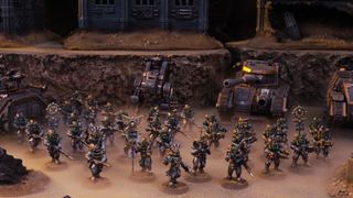 The armies of the Solar Auxilia line up for battle on a rocky field
