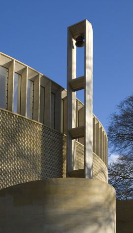 An oak bell tower engineered by Glulam is perched on the chapel's exterior