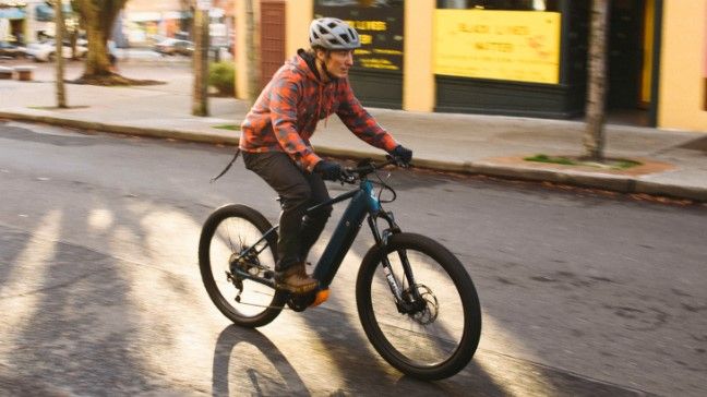 Man riding Diamondback Response electric bike