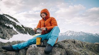 how to clean camping cookware: backpacker cleaning pot