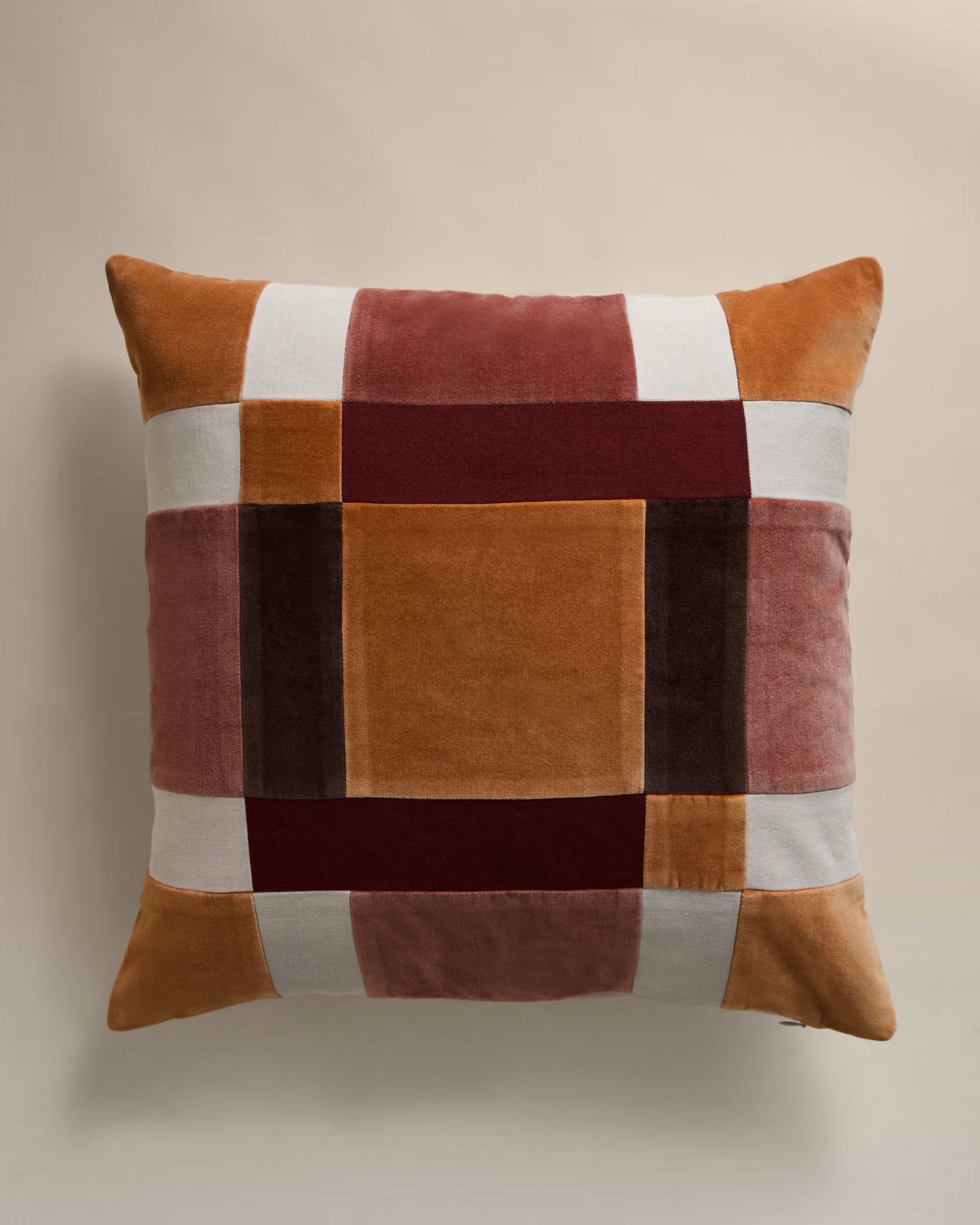 pink and dark orange patchwork cushion