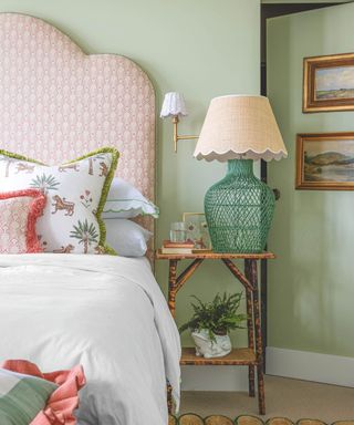 bedroom with green walls concealing secret door