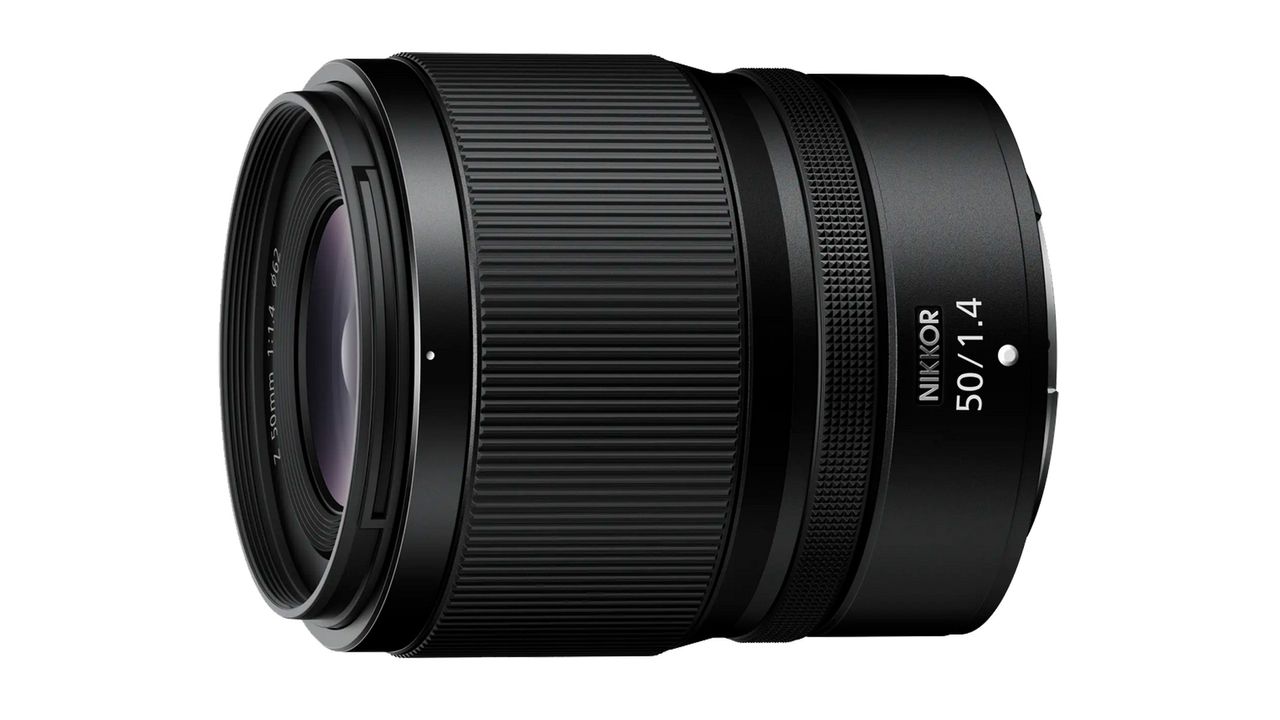 A NIKKOR Z 50mm f1.4 lens on a white background.