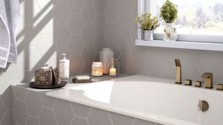 built in bath with grey tiles