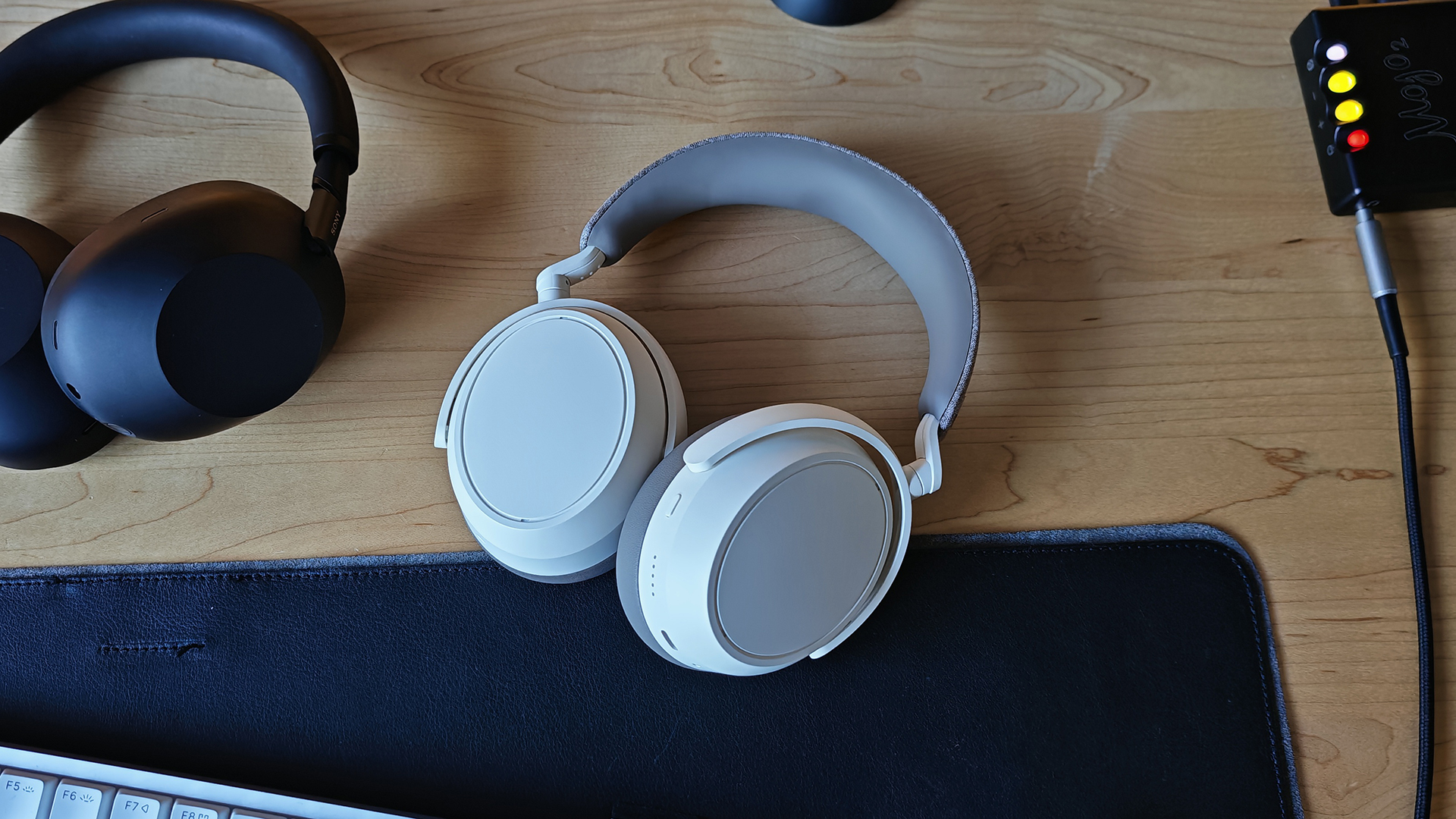 The Sony XM6s and the Momentum 4s on a desktop. 