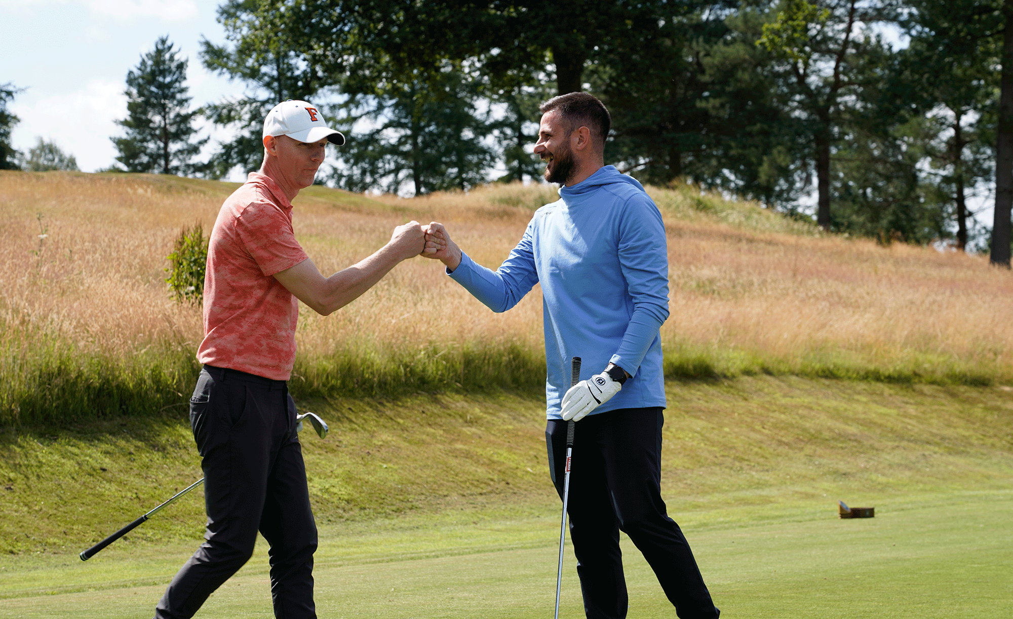Baz Plummer celebrating with his playing partner after breaking 100