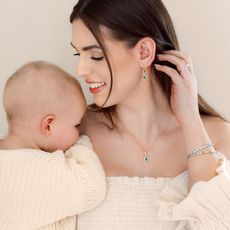 Model with baby wearing Angara jewellery