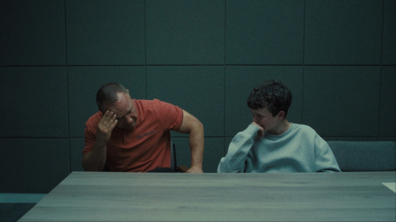 Eddie and Jamie crying in a police interview room in Netflix's Adolescence TV series