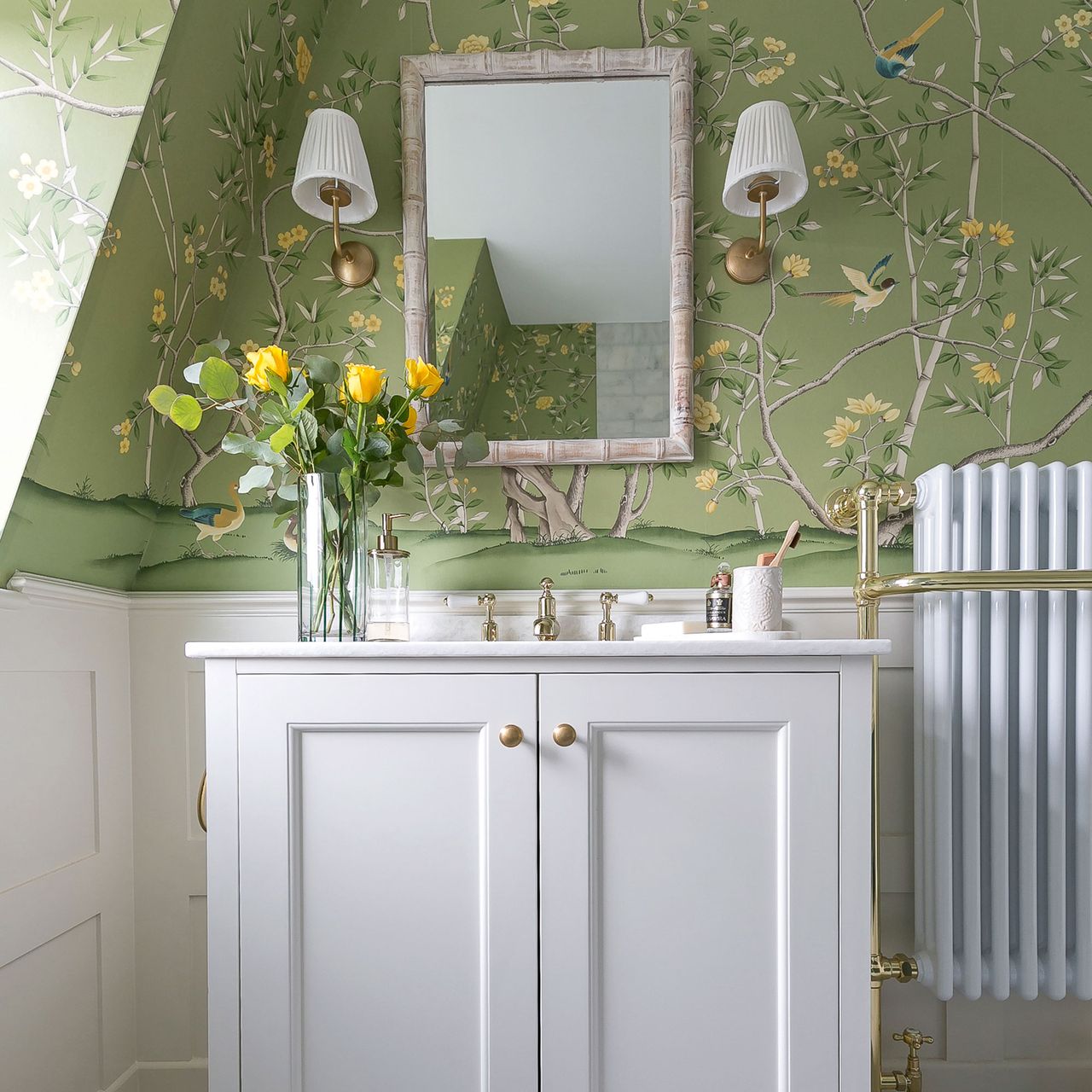 This loft bathroom hadn't been touched since the 90s, but a mix of wallpaper and marble has transformed it into the perfect retreat.