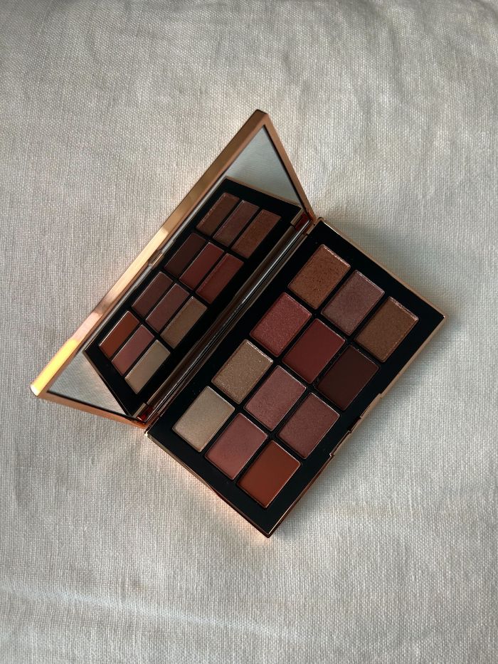 Nars Afterglow Irresistible Eyeshadow Palette on a white linen background