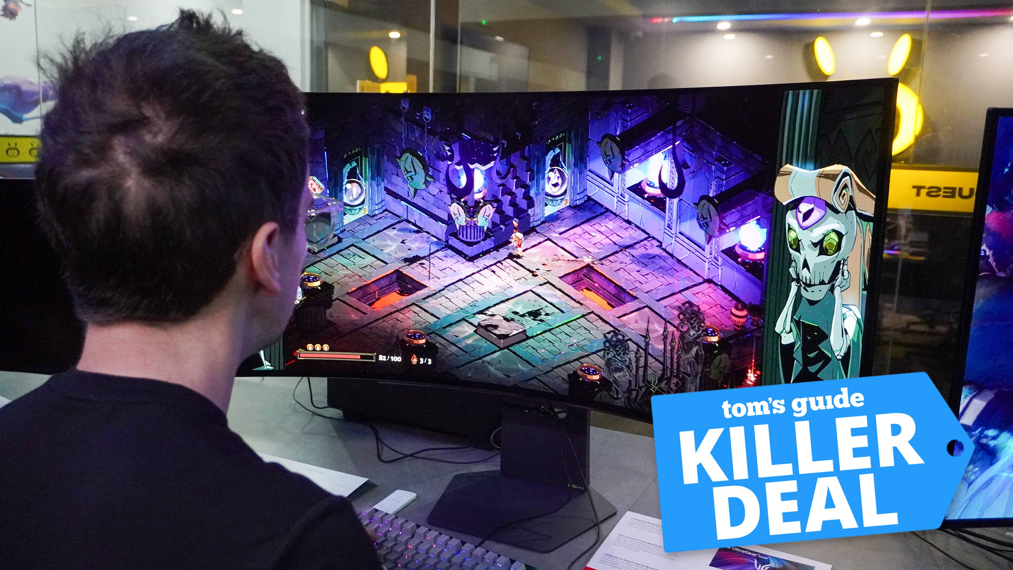 LG UltraGear 45GX90SA on table with person looking at it at an angle with Tom's Guide Killer Deal badge