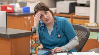 Allison Tolman looking tired at a desk in St. Denis Medical