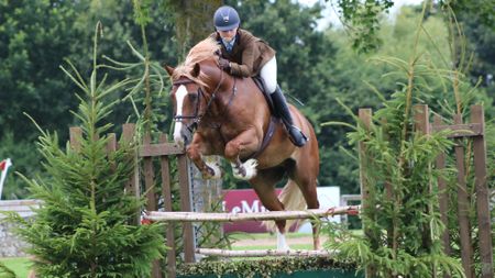 Ellie Callwood riding Penstrumbly Calon Lan in the M&M working hunter pony class at Royal International Horse Show