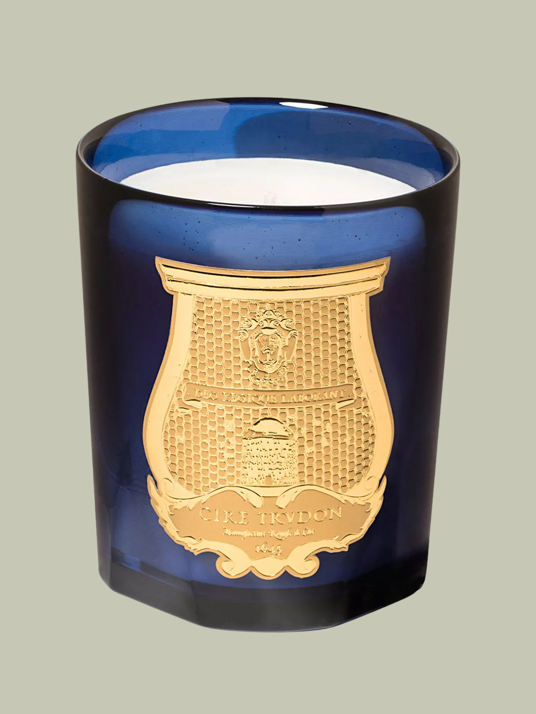 A blue glass scented candle from Trudon