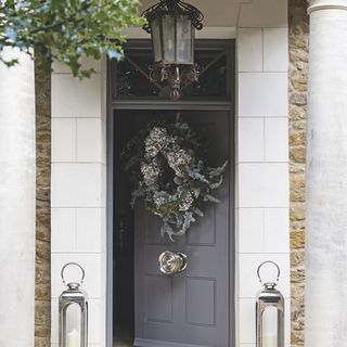 house entrance with grey door and wreath