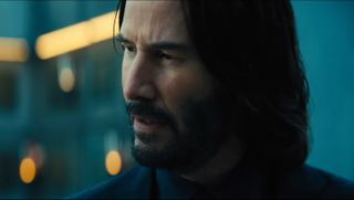 John Wick looking to the left on a gray day