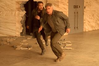 Actors Ryan Gosling (left) and Harrison Ford in a scene from "Blade Runner 2049."