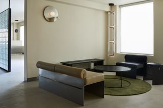A living room with a couch with a metal frame