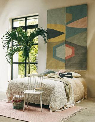 Rug used as wall hanging in a bedroom