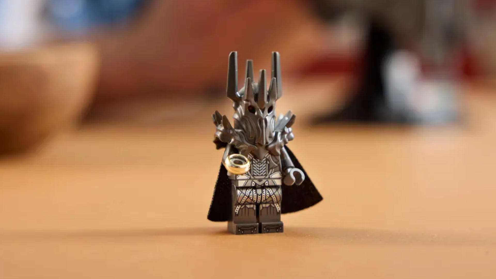 Lego Sauron minifigure on a wooden surface