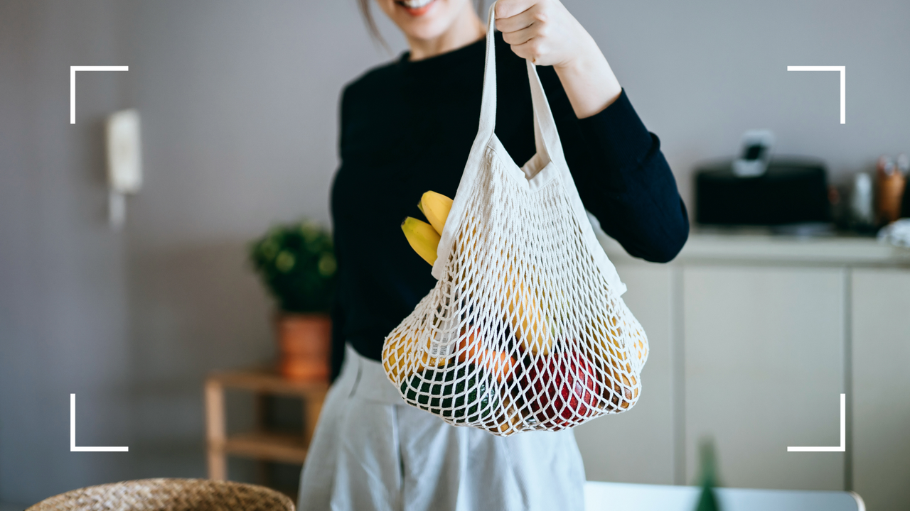 Woman holding bag of groceries