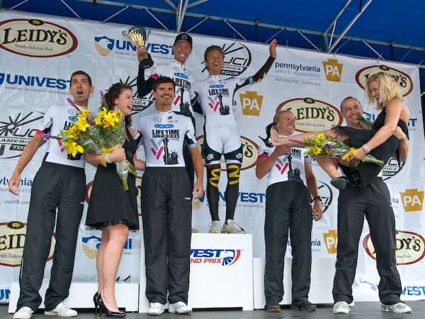Amore &amp; Vita wins the 2009 Univest Grand Prix Team Time Trial and celebrates accordingly by having Yuri Metlushenko lift the trophy girl.