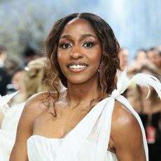 ayo edebiri attends the 2026 met gala wearing honey brown hair and a white gown