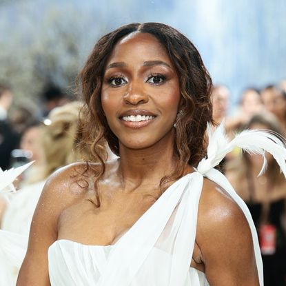ayo edebiri attends the 2026 met gala wearing honey brown hair and a white gown